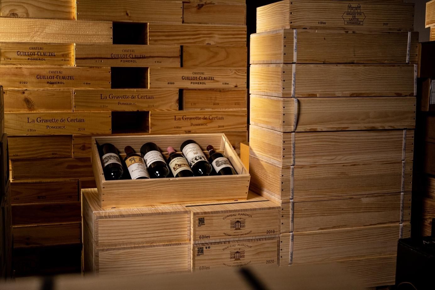 Cases of Vinesia wine neatly arranged in a warehouse, showcasing the brand's extensive selection and storage excellence